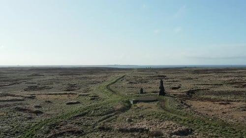 Reykjanesbær sign with white letters on hill in Iceland, aerial