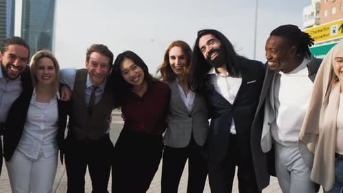 Team of multiracial business people with different ages and ethnicities standing in the city center