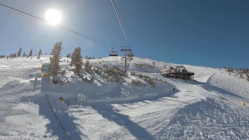 View from a ski lift to another ski lift between slopes