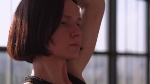 Woman Doing Arm Stretches Close Up