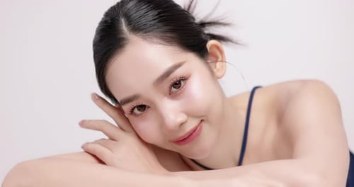 Slow motion of beautiful young Asian girl with k-beauty make up style.