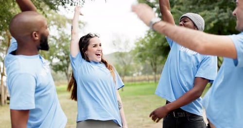Enthusiastic Volunteers Celebrating Success in Nature