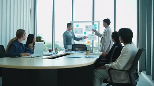 Business Team Discussing Data Analysis in Modern Office