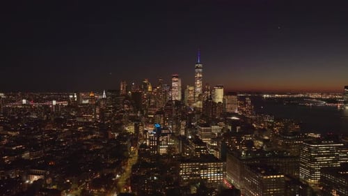 Aerial View Captured with a Tripod of Lower Manhattan's Skyline Glowing Skyscrapers Including One