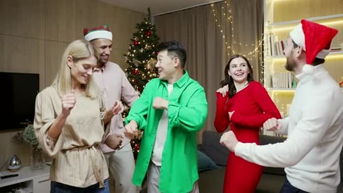 Diverse Friends Dancing at Fun Christmas Party