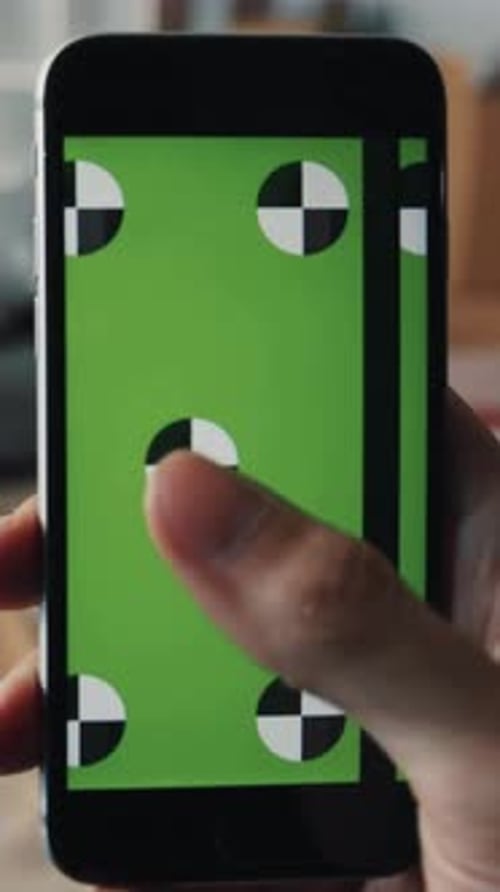 Finger Tapping Green Screen Smartphone Near Moving Boxes