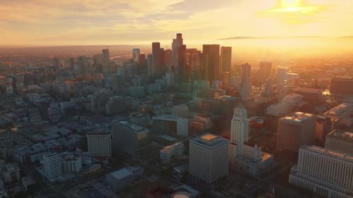 Immense scenery of stunning Los Angeles at sunset. Downtown with skyscrapers from aerial perspective