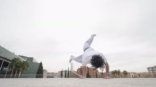 Young Man Breakdancing in the City
