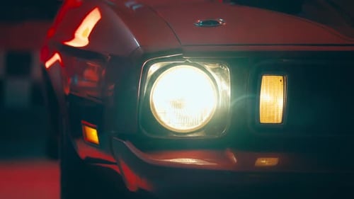 Dramatic Close-Up of a Headlight Turning Off