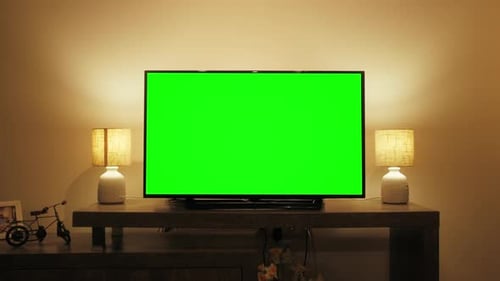 LcD Smart TV Screen with a Blank Green Background in the Living Room Chroma Key Screen for