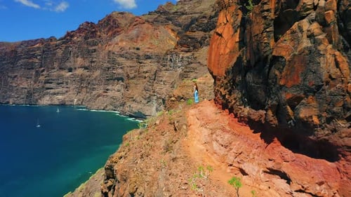 Woman Posing on Mountain Overlooking Ocean