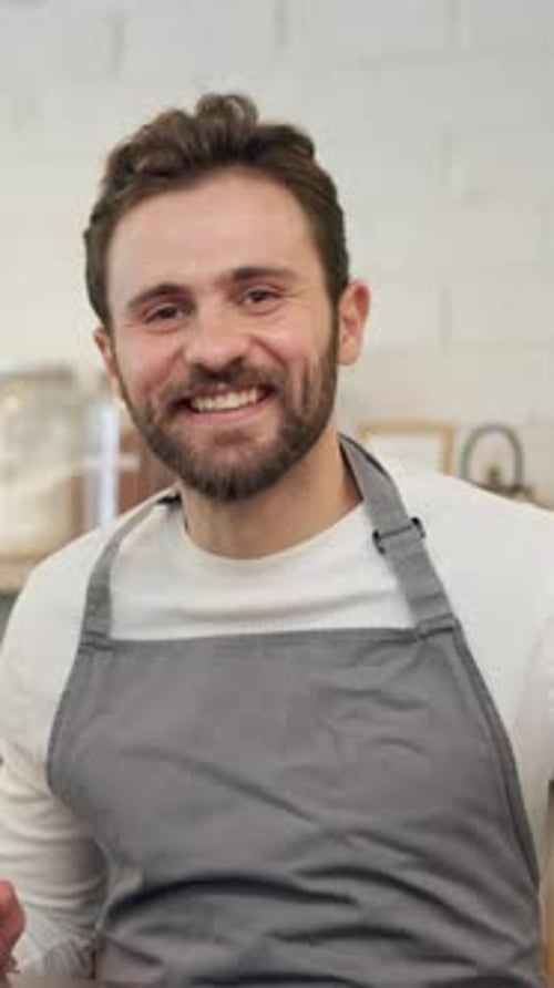 Happy, man and face of barista in coffee shop with confidence for service career in restaurant
