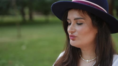 Woman Eating Watermelon Outside