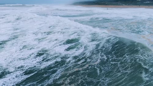 Turbulent Ocean Waves Crashing Along Coastline