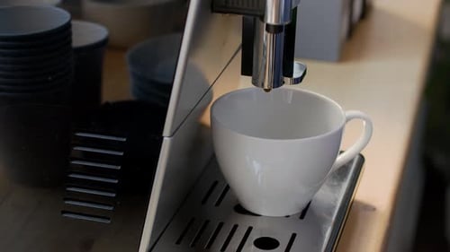 Fresh Hot American Coffee Being Brewed in Coffee Machine in Office
