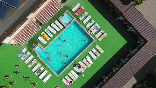 Vacational outdoor swimming pool. Holiday resort summer pool aerial view.