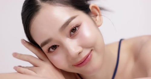 Slow motion of beautiful young Asian girl with k-beauty make up style.