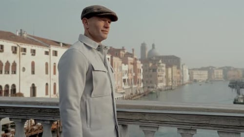 Man Walks Across Venice's Historic Bridge