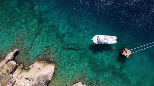 Aerial View of Tropical Beach with Swimmers