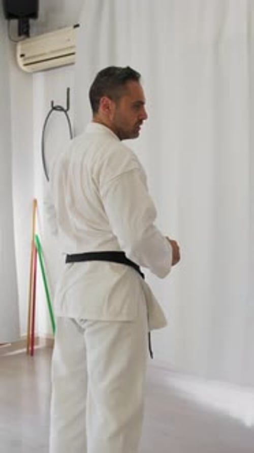 Man Practicing Karate in Studio