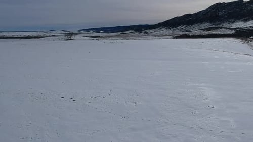 Snowy Rural Landscape Aerial Shot