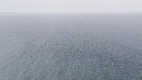 Aerial View of Ocean with Ships Seen in Distance