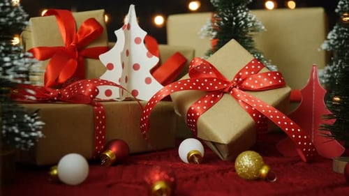 Festive Christmas Gifts and Decorations on Red Blanket