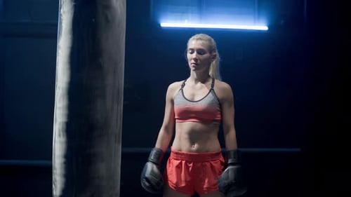 Woman Boxer Ready to Train at Gym