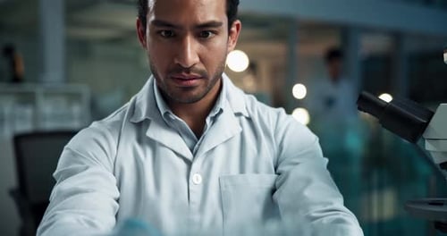 Scientist Recording Research in Modern Laboratory Setting