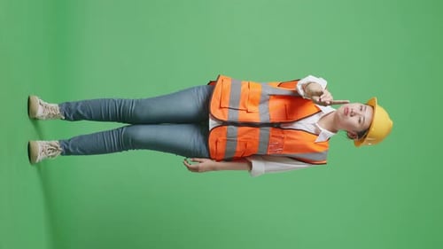 Female Engineer With Safety Helmet Disapproving With No Index Finger Sign On Green Screen