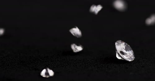 Diamonds Falling in Slow Motion on Black Surface