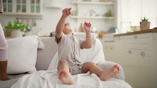 Adorable Child Reaches for Balloon Indoors