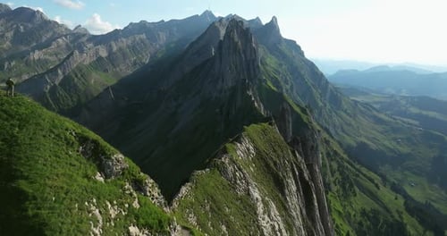 Aerial View of Sharp Green Mountain Peaks and Jagged Ridges