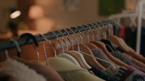 Clothing Rack with Vintage Garments in Cozy Second Hand Shop
