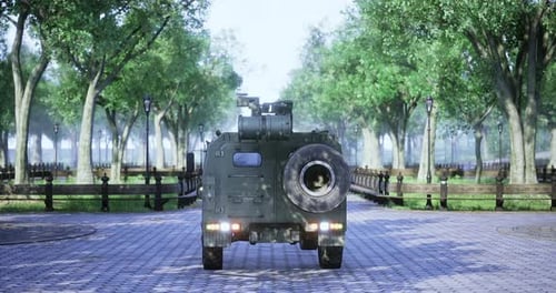 Military Vehicle Makes Its Way Down a Serene Park Path in Daylight