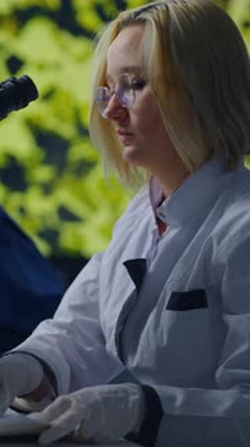 Female Scientists Working with Microscope in a Laboratory
