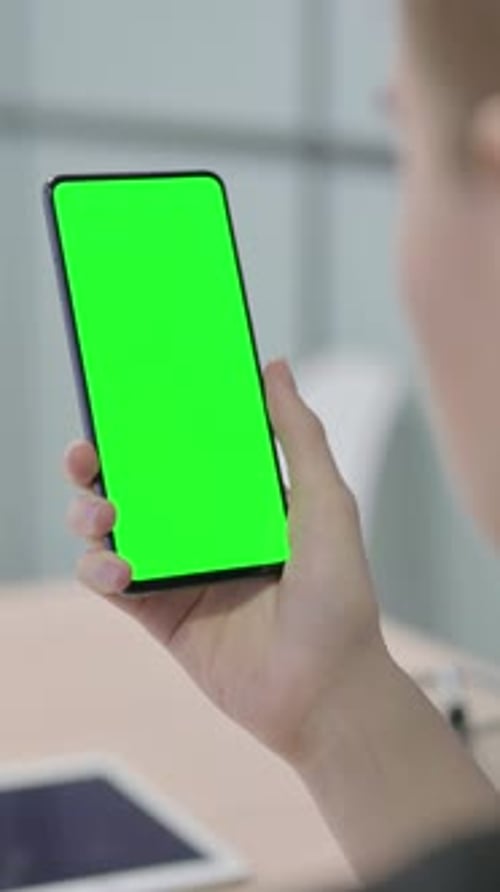 Businesswoman Using Smartphone with Green Screen, Vertical Video