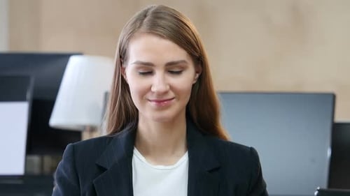 Smiling Woman in Suit Close Up Office Setting