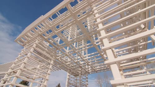 Elegant Arbor Made of Thin Wooden Planks in City Park