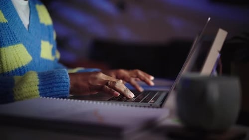Unrecognizable Woman Hands Using Computer to Work From Home During Nighttime