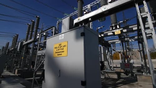 Circuit Breaker with Yellow Sign at Electricity Substation