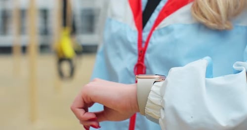 Close Up Woman Checking Results on Smartwatch After Training Healthy Lifestyle Concept
