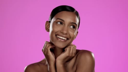 Beauty, skincare and happy Indian woman in studio posing with hands, cosmetics
