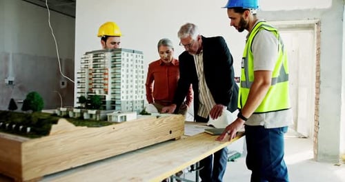 Construction, building model and blueprint meeting with architecture, collaboration