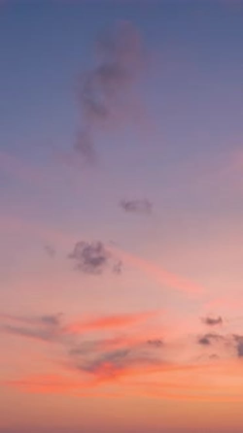 Twilight and dawn sky with cumulus cloud vertical time lapse in an evening.