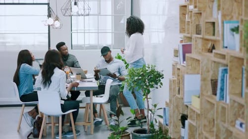 Team Brainstorming Ideas in a Modern Office