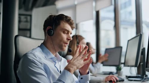 Operator Listening Customer Online in Office Focused Man Agent Think Solution