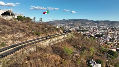 Aerial view of Mexican Flag flying above Oaxaca City