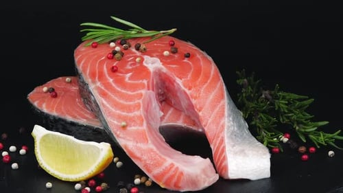 Trout Steaks Rotation Video. Raw Slices with Perfect Texture of Uncooked Red Fish. Sea Food