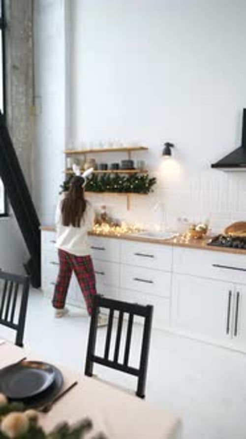 Woman Decorating Table for Christmas Celebration Indoors